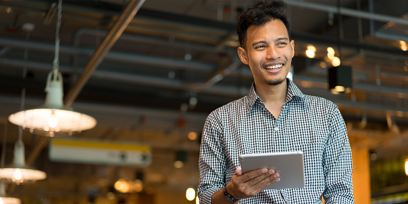 man holding ipad